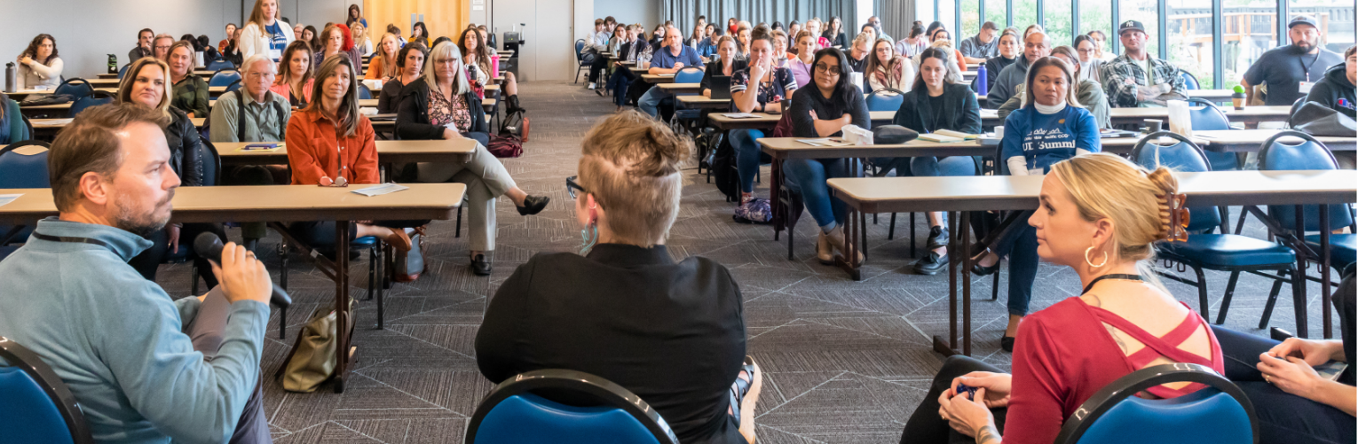 Panelists speak in front of a packed room at the Columbia Pacific Substance Use Disorder Summit.